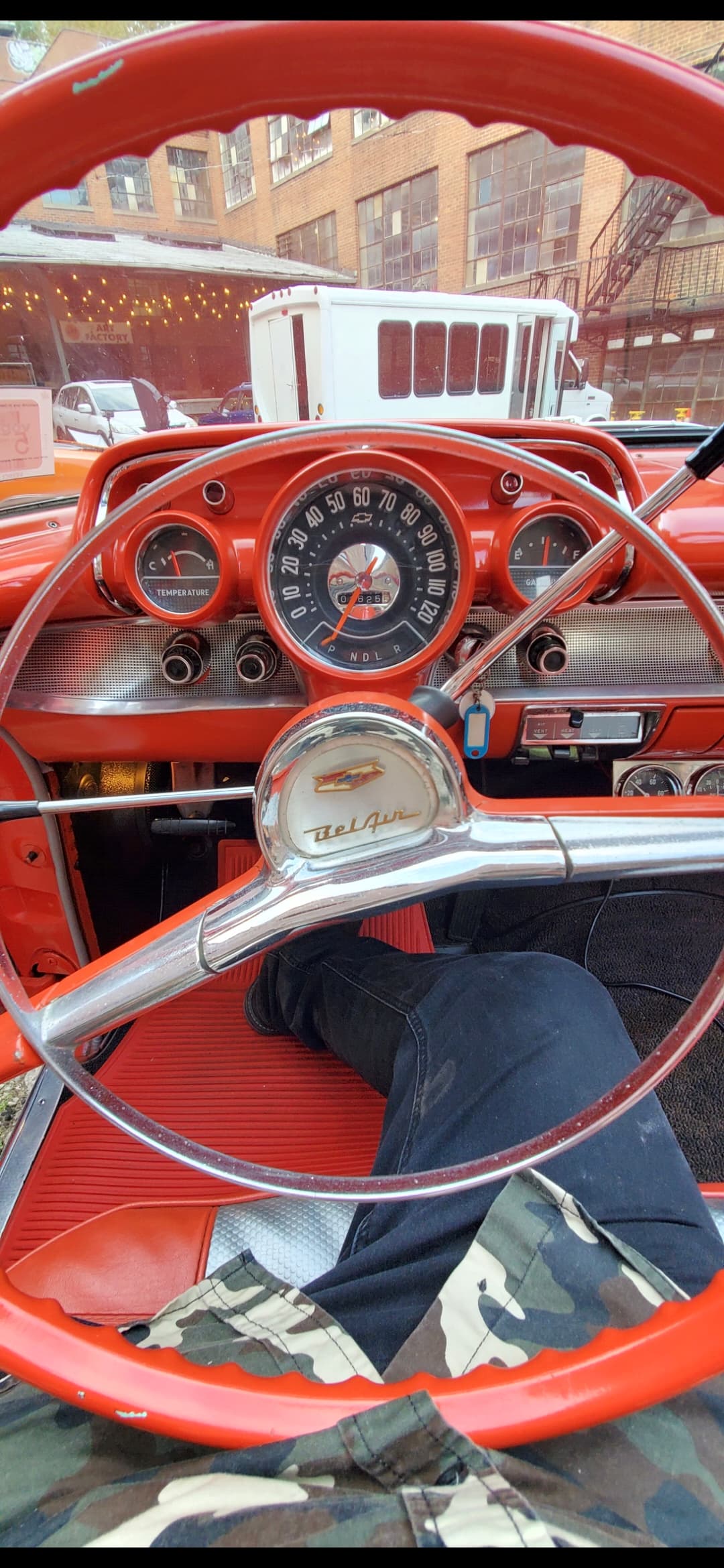 Driver's view of the red interior of a vintage Chevrolet Bel Air