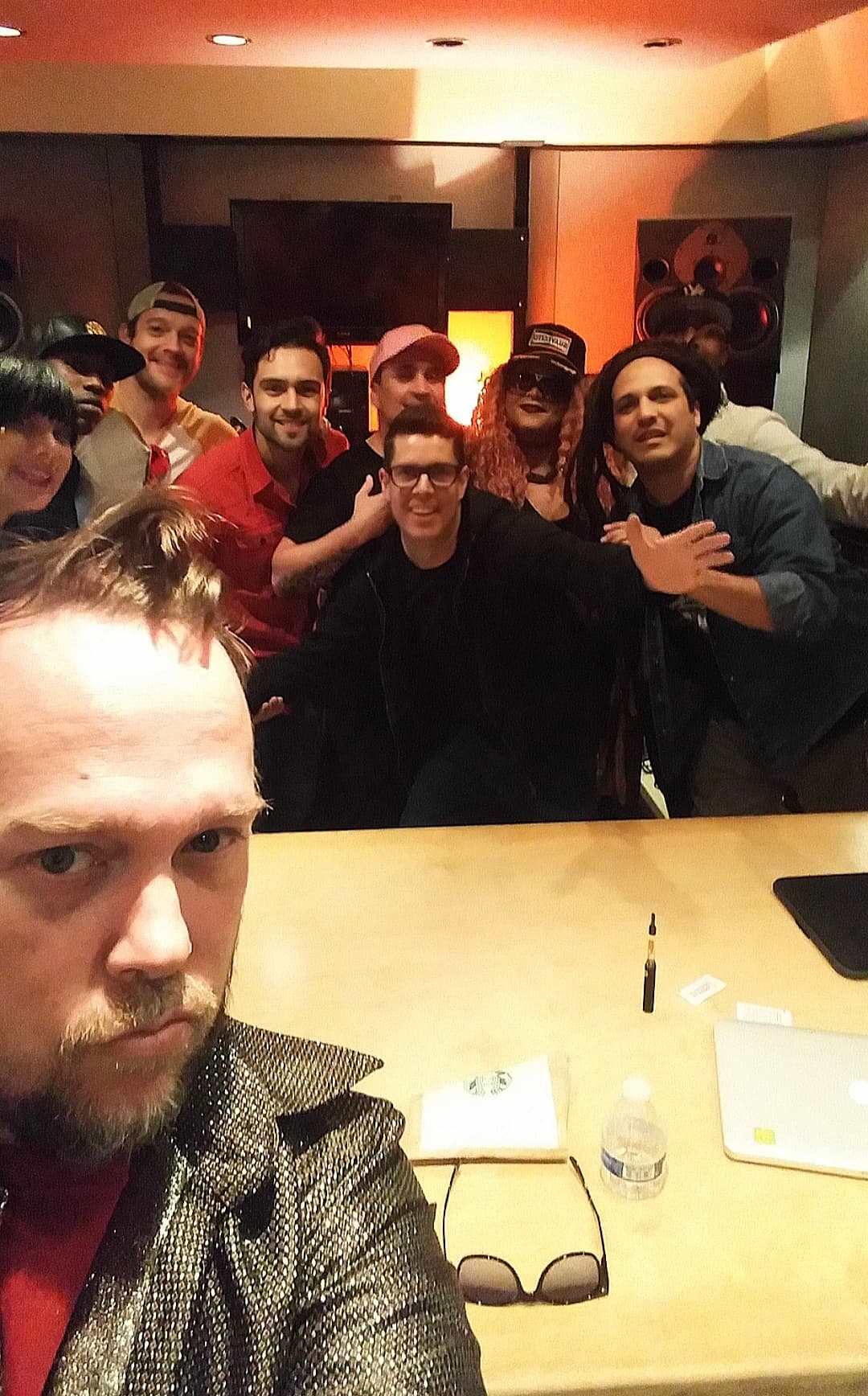 Kene Bell in the foreground with Ivan Gutierrez and a studio group behind him
