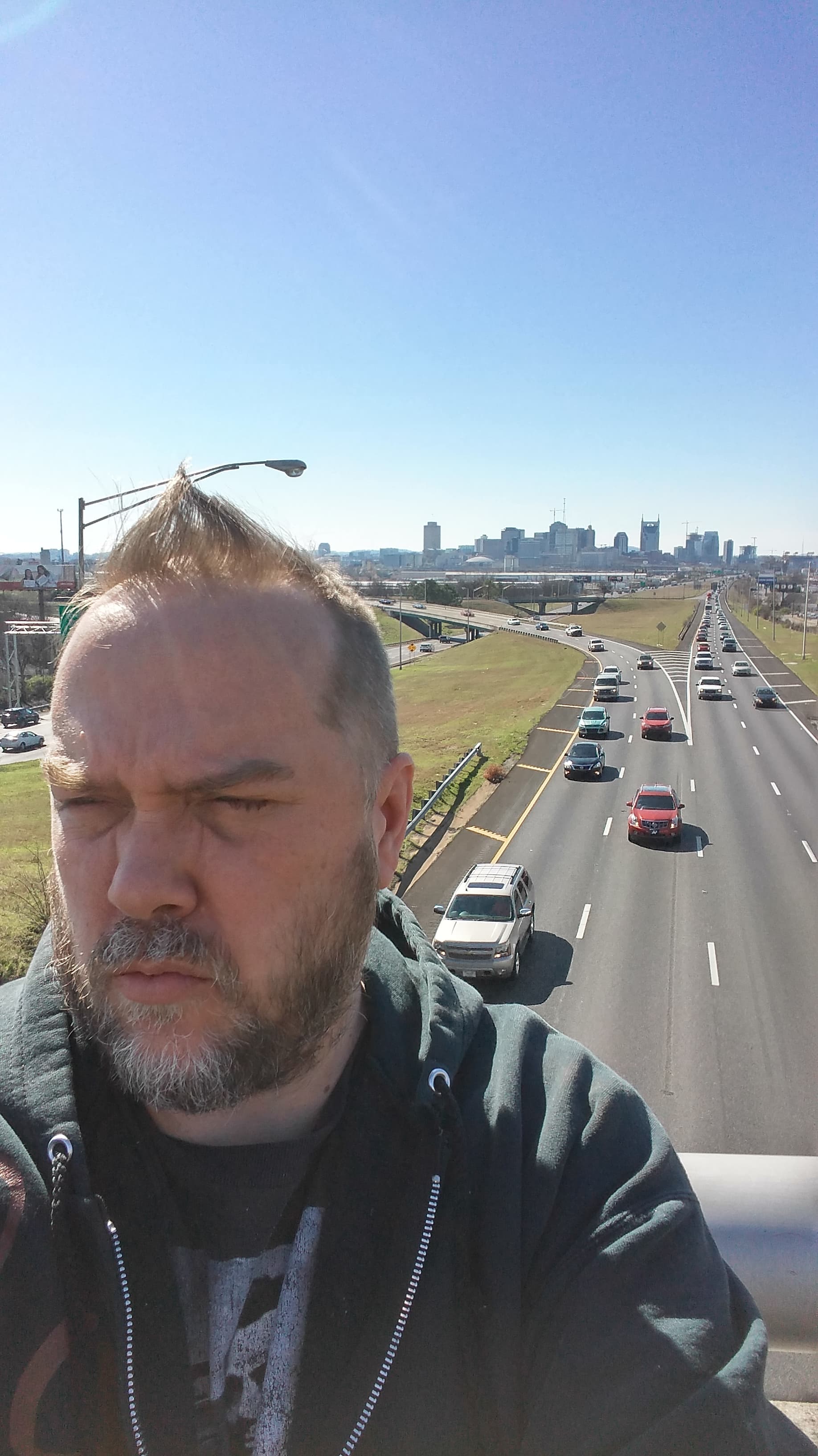 Kene Bell framed against the Nashville skyline and interstate