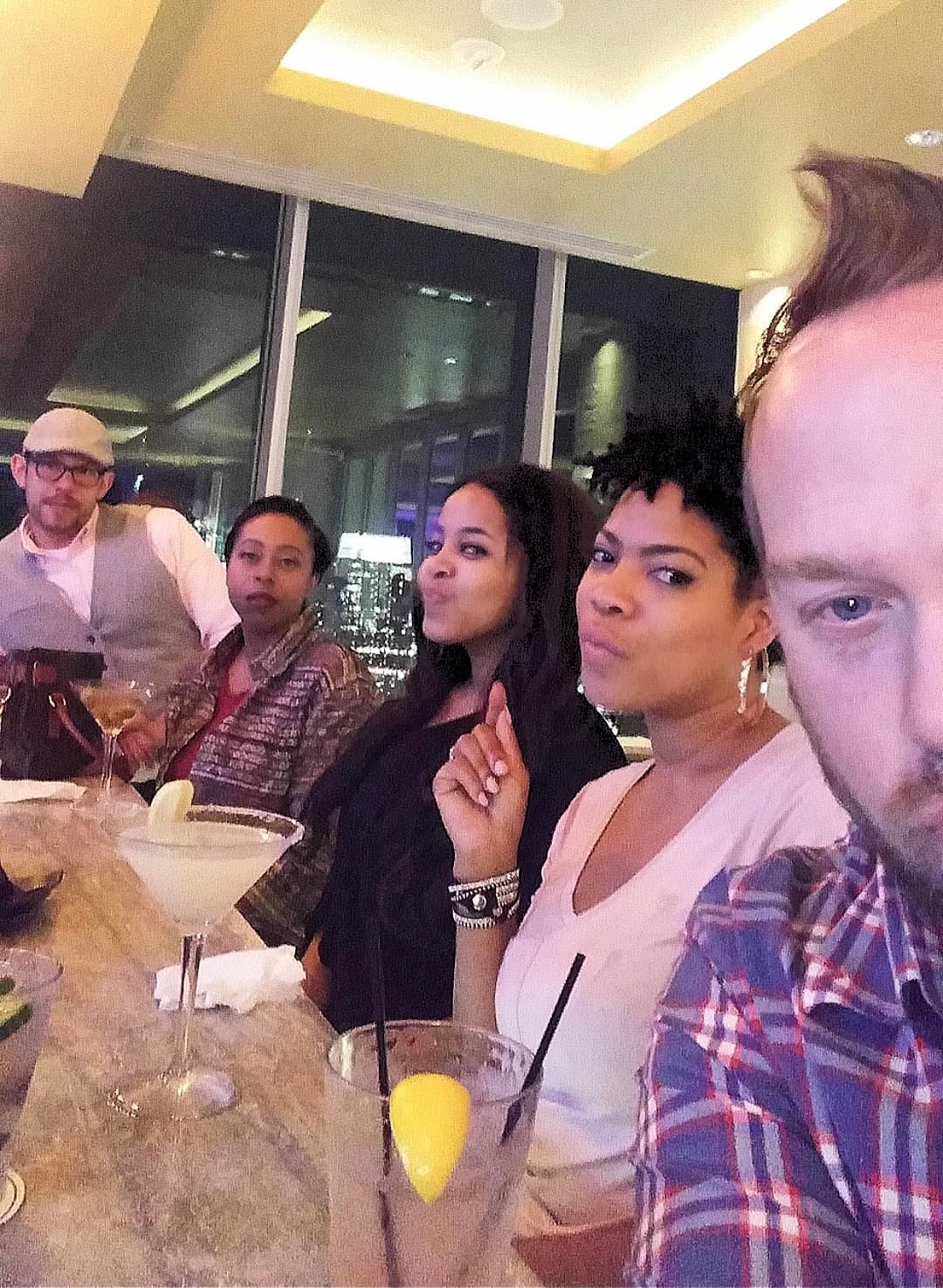 Kene Bell and friends sharing dinner and drinks