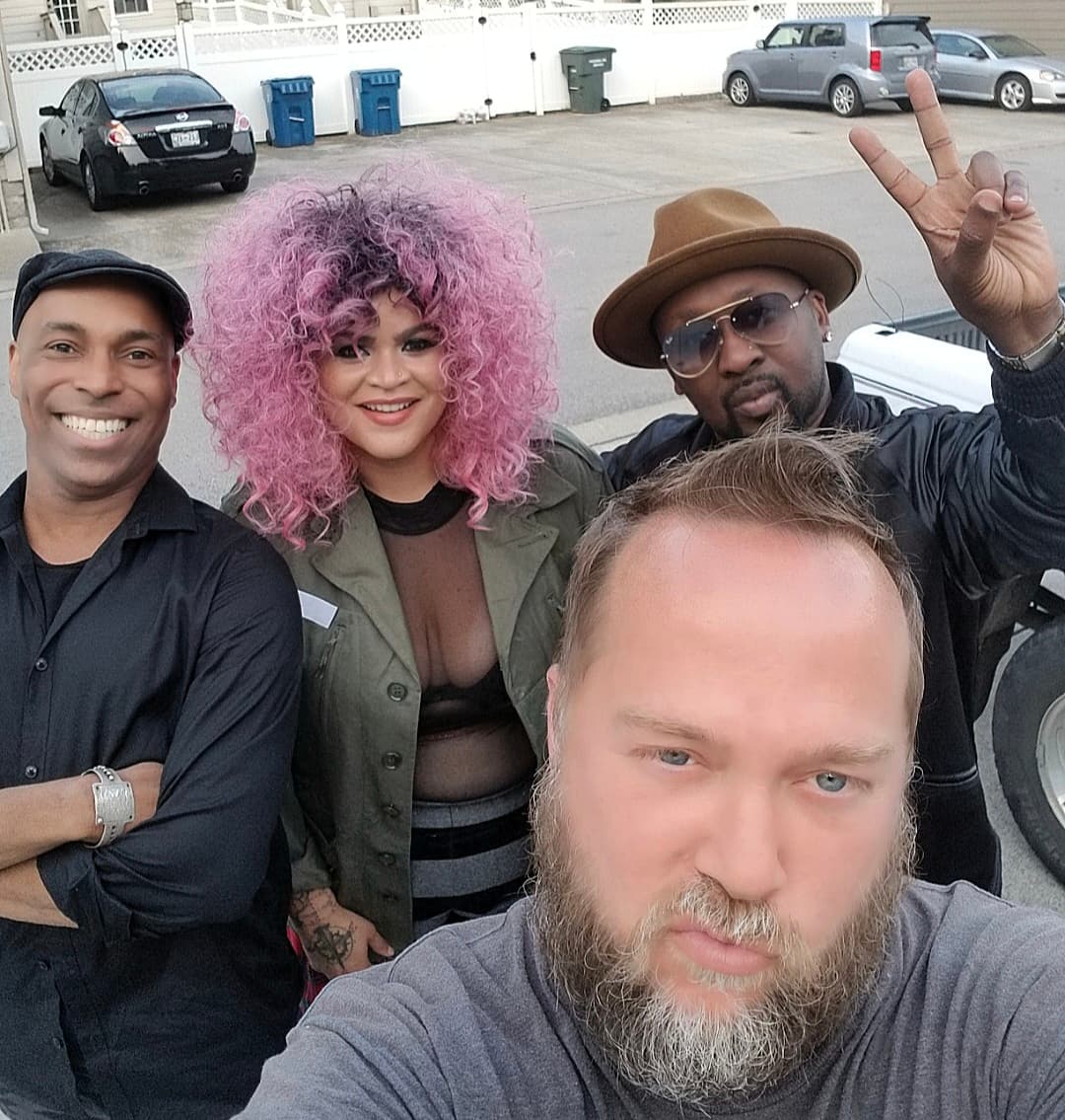 Kene Bell with friends in an outdoor group selfie