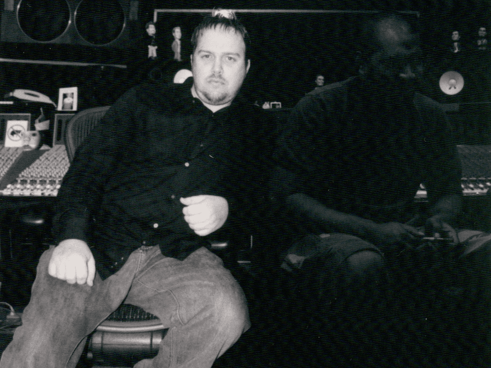 Black-and-white historical portrait of Kene Bell seated in the recording studio