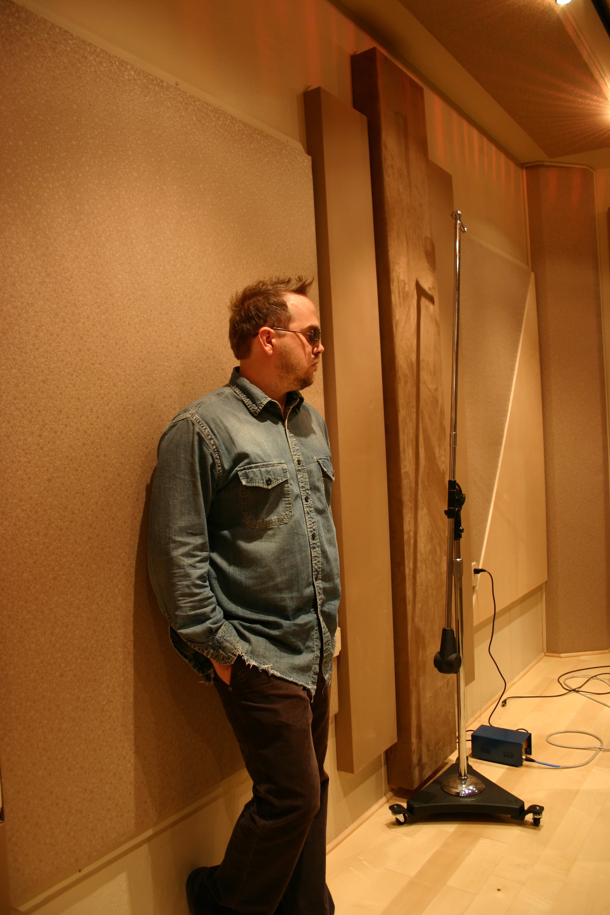 Kene Bell standing in an Arizona studio vocal room
