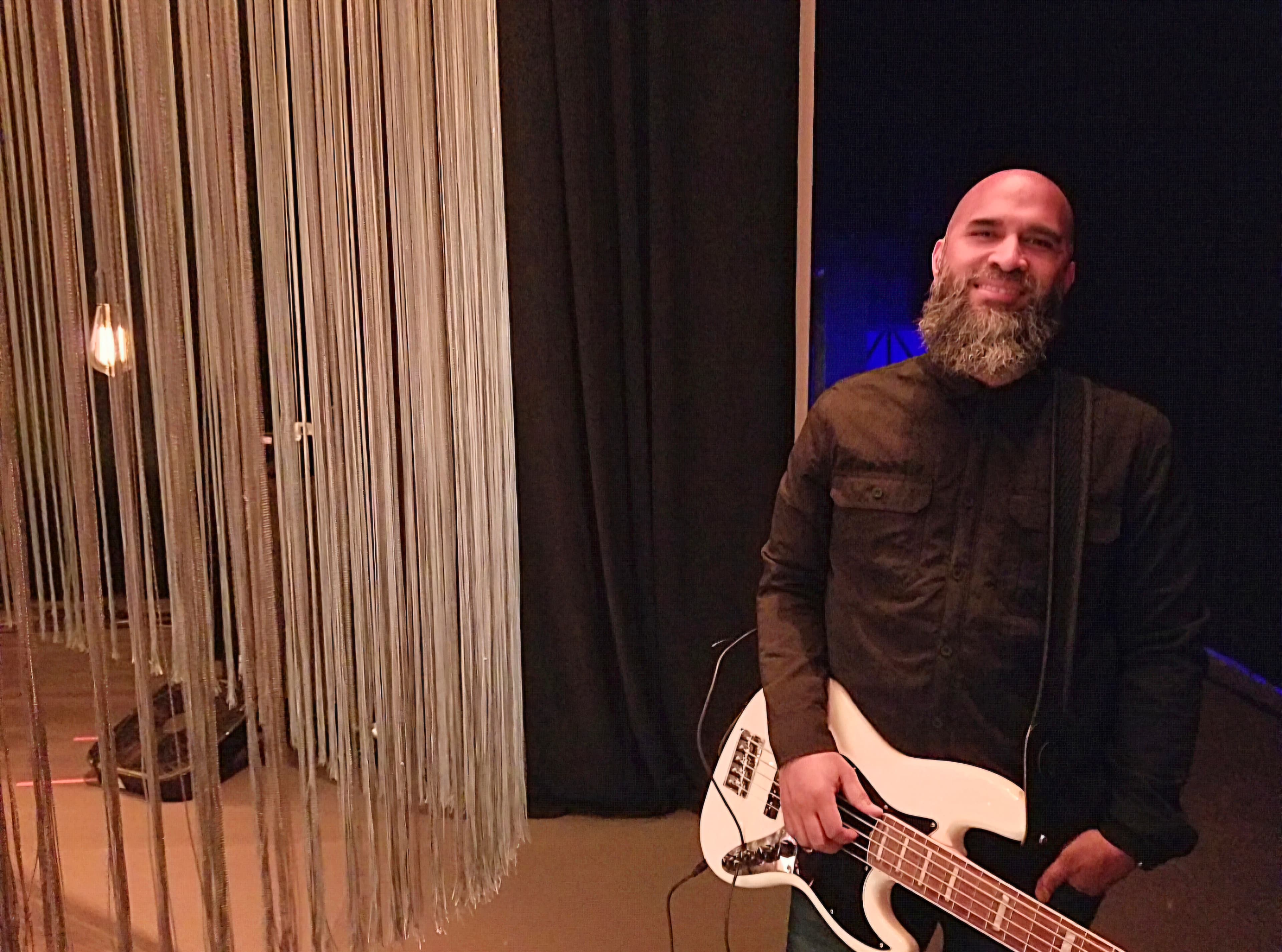 James Katina holding a bass guitar during the Nashville period