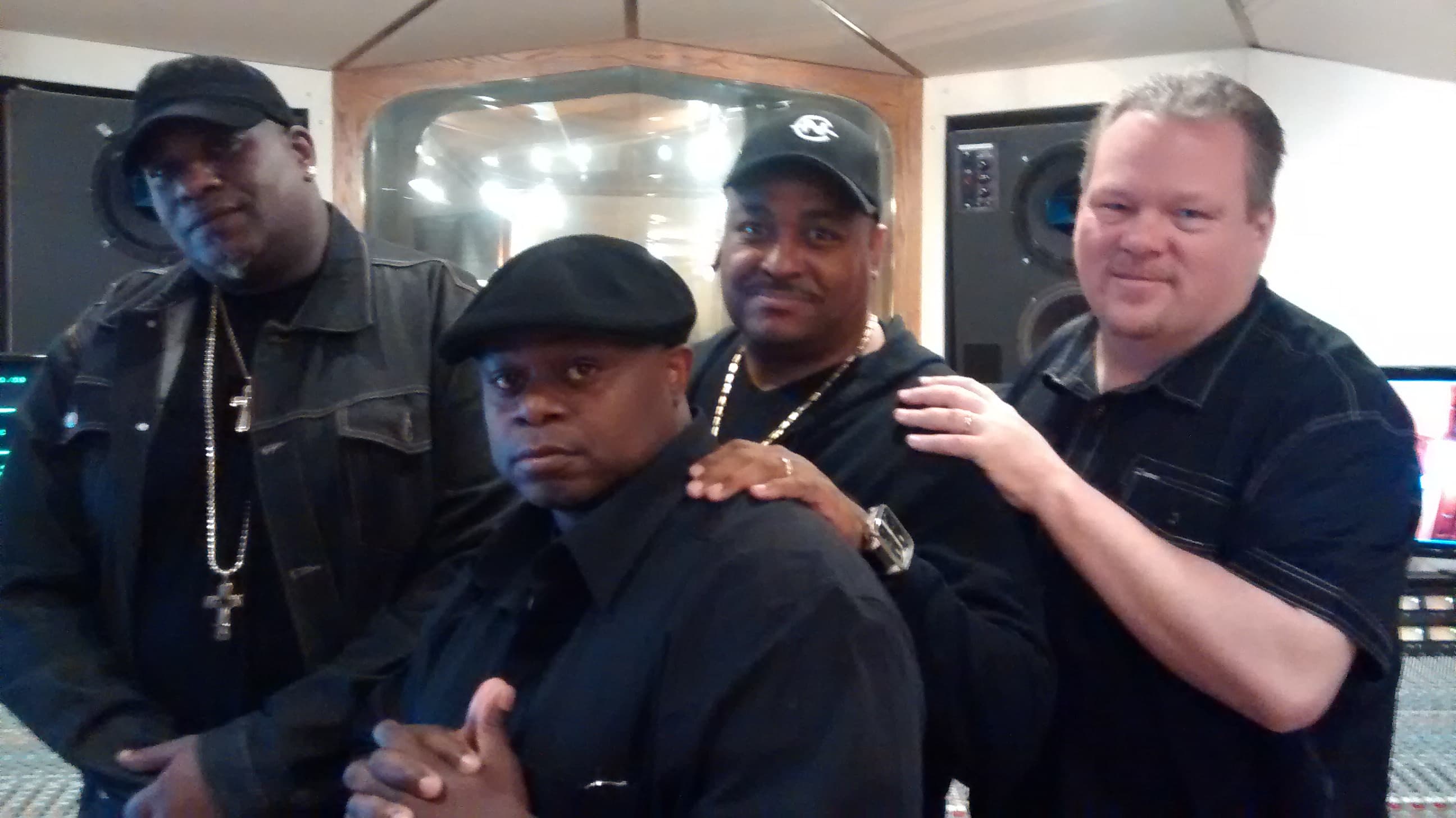 Four members of the D.O.C. group together in a recording studio