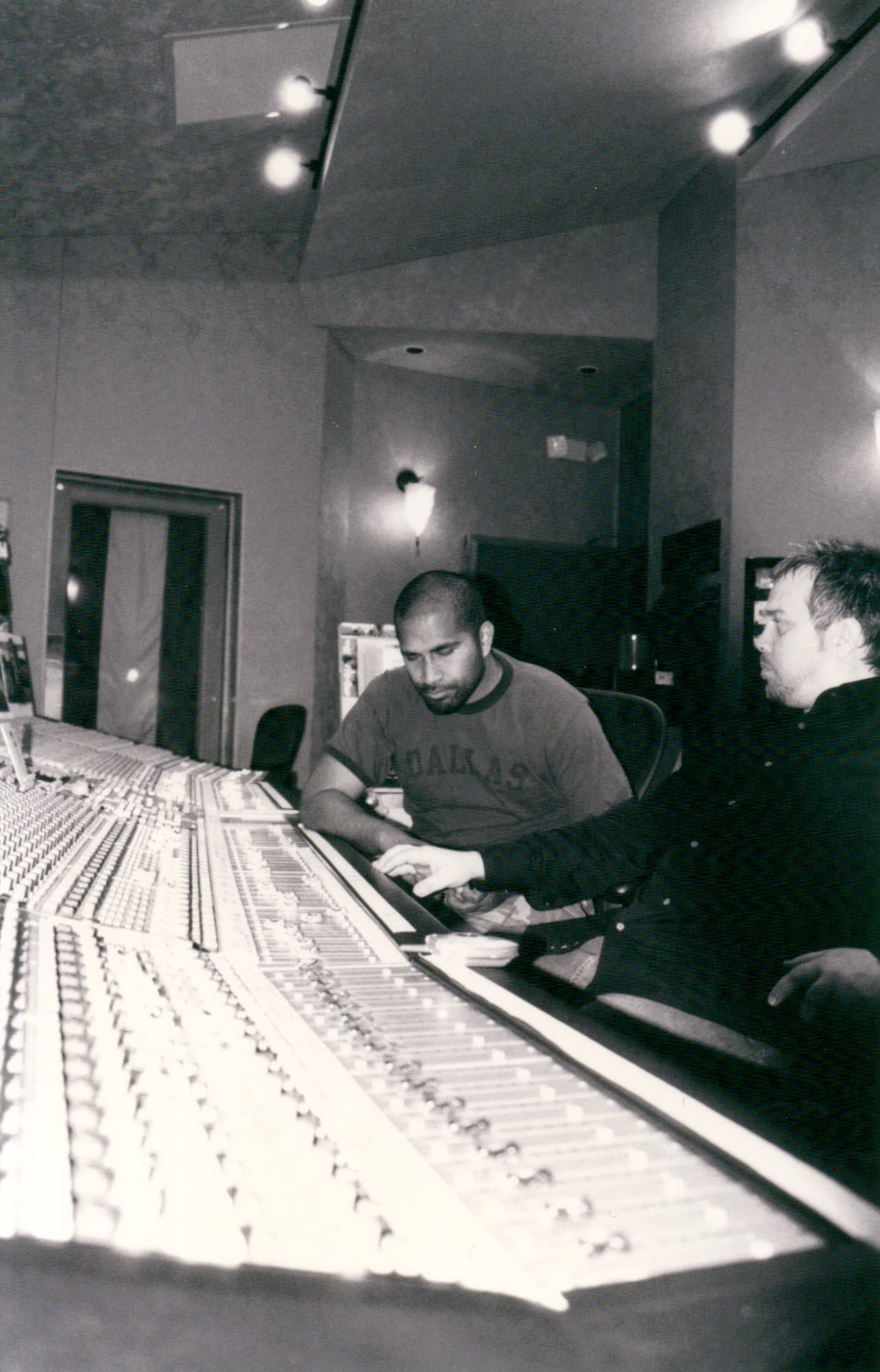 Two people working at a studio console during the Katinas period