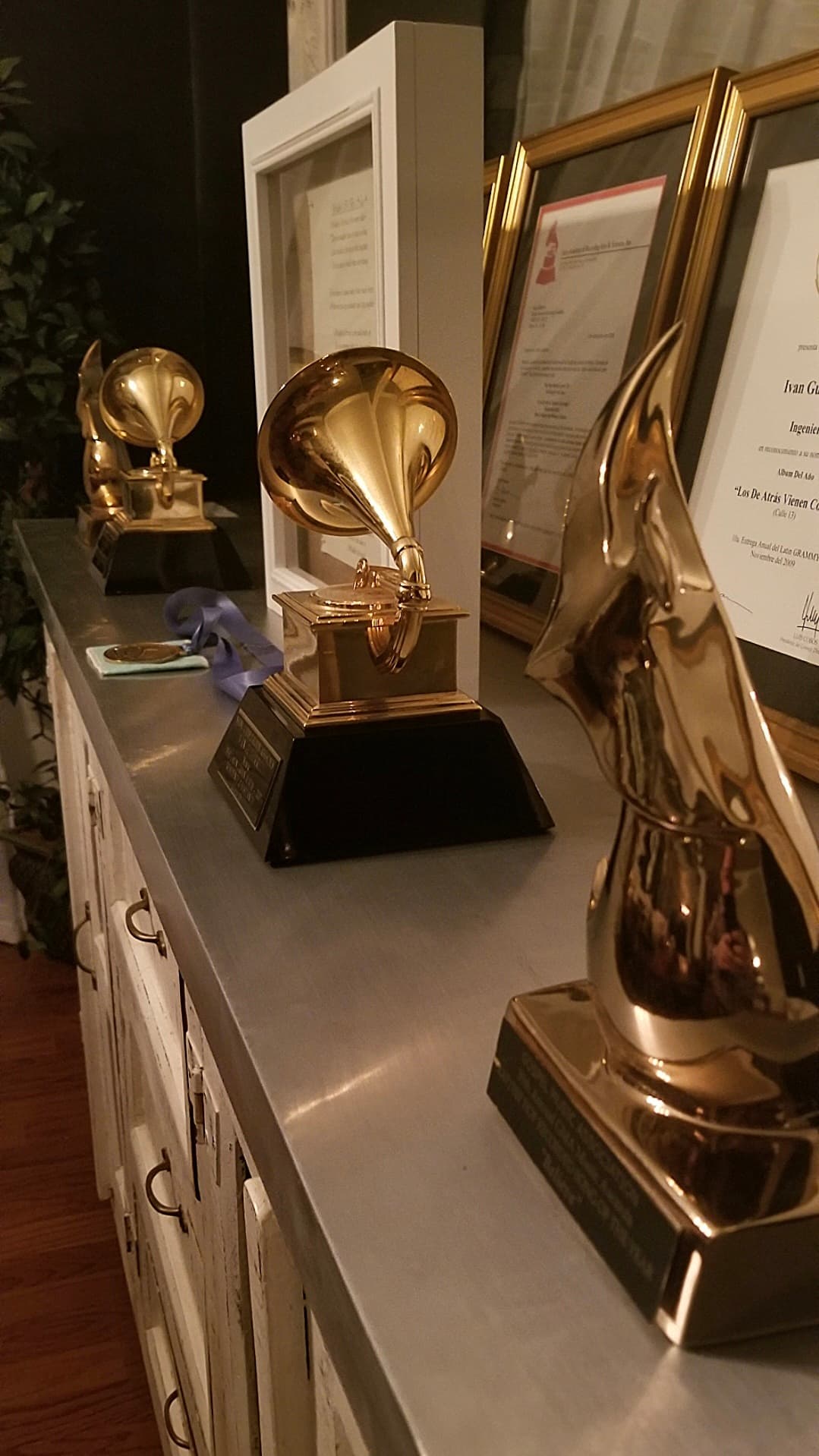 Kene Bell's awards displayed from the side