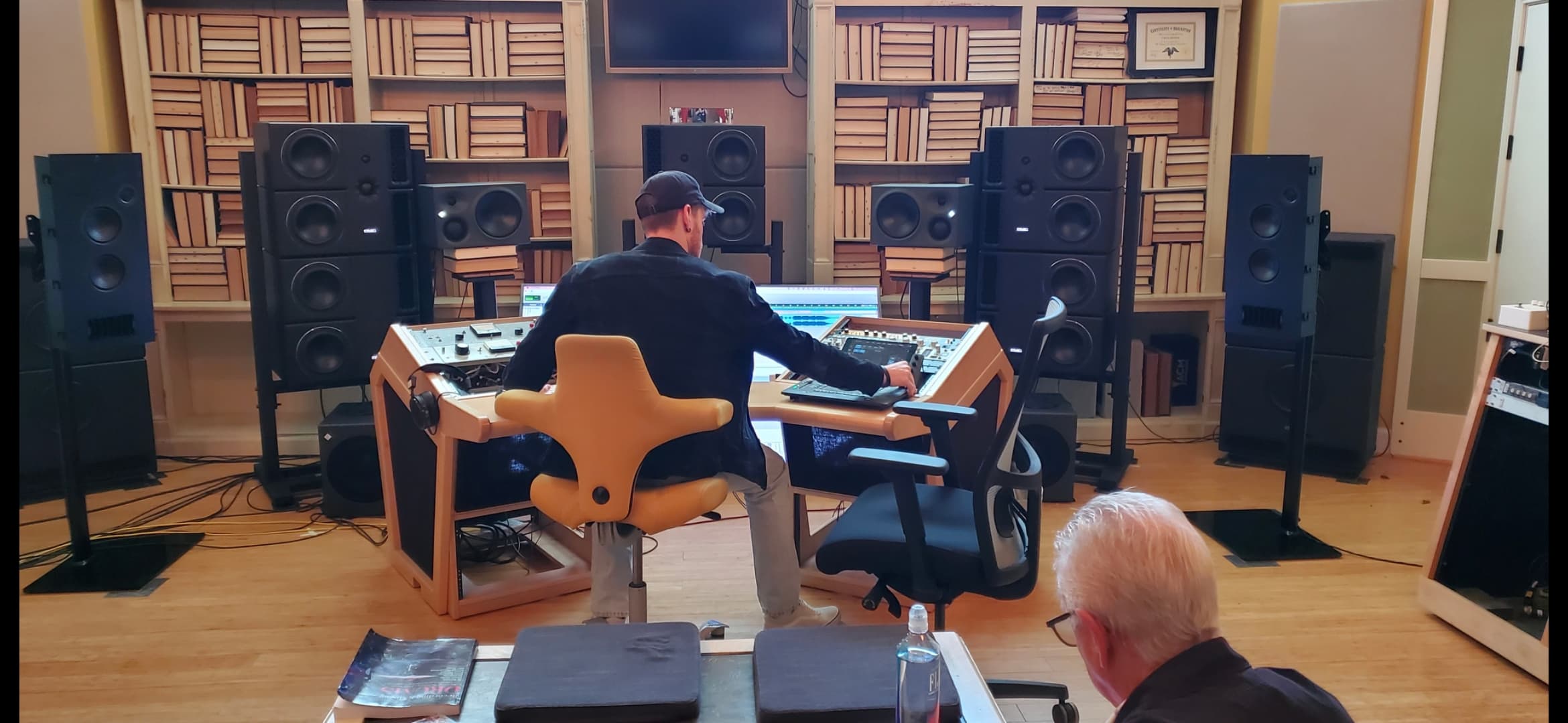 Engineer working in a large professional monitoring and control room