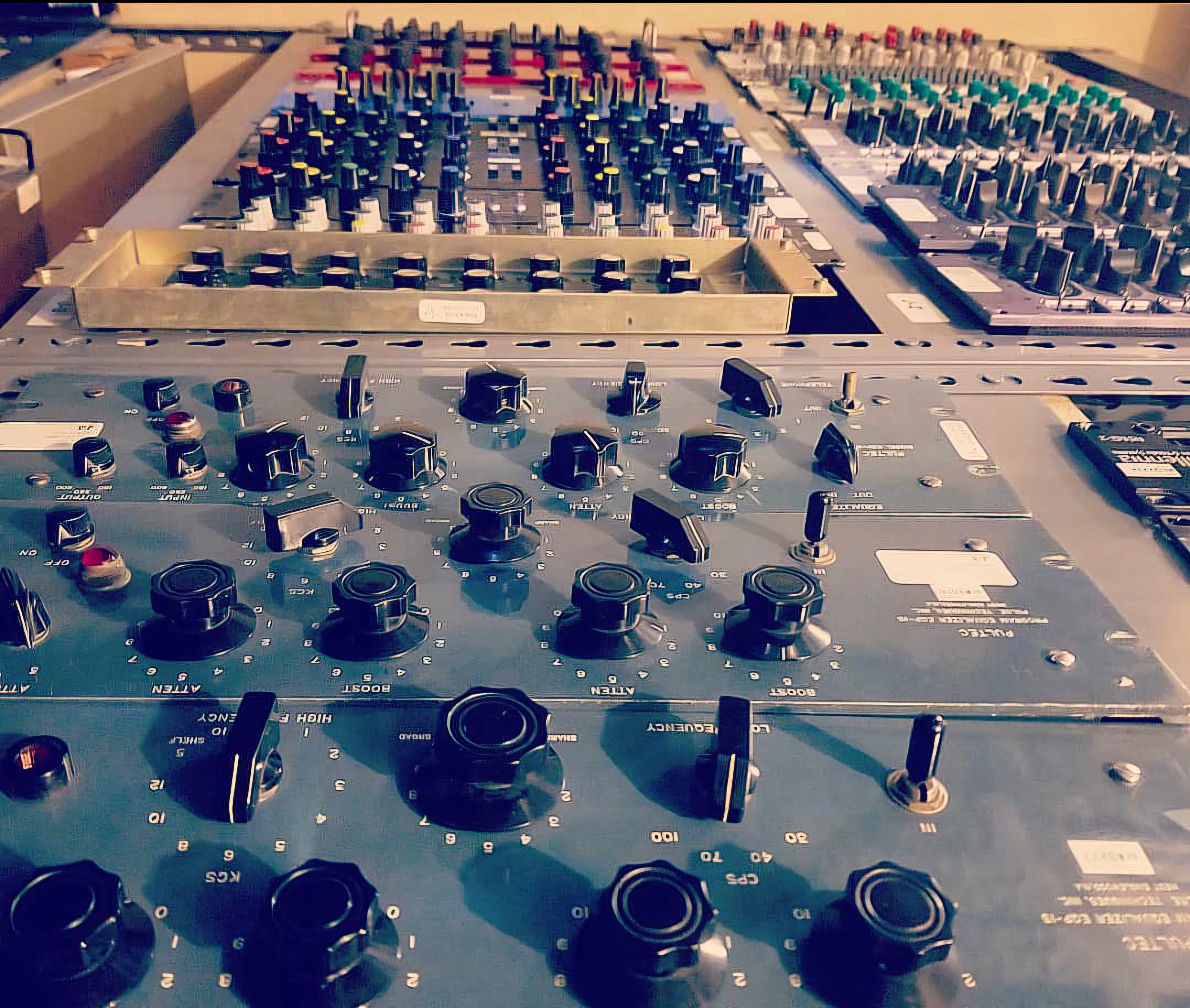 Detailed close-up of analog mixing-console controls