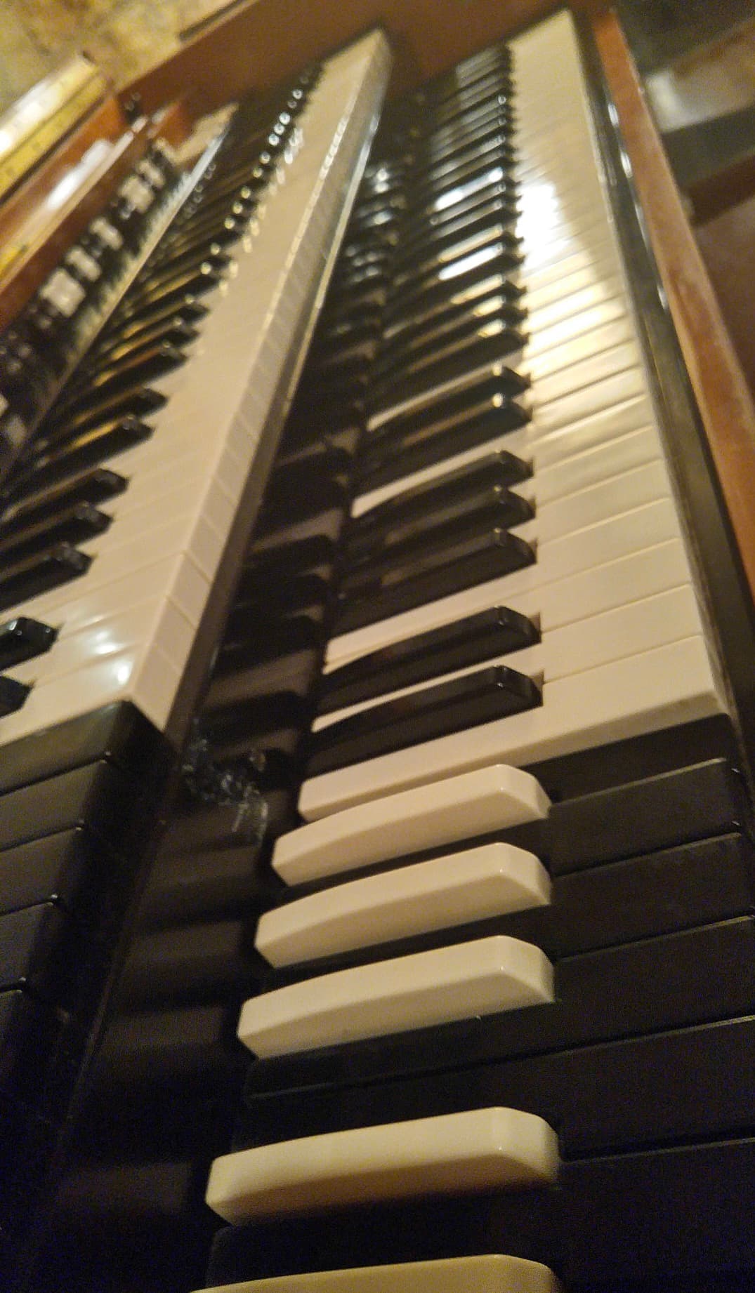 Close-up of the keys and controls of a vintage keyboard or synthesizer