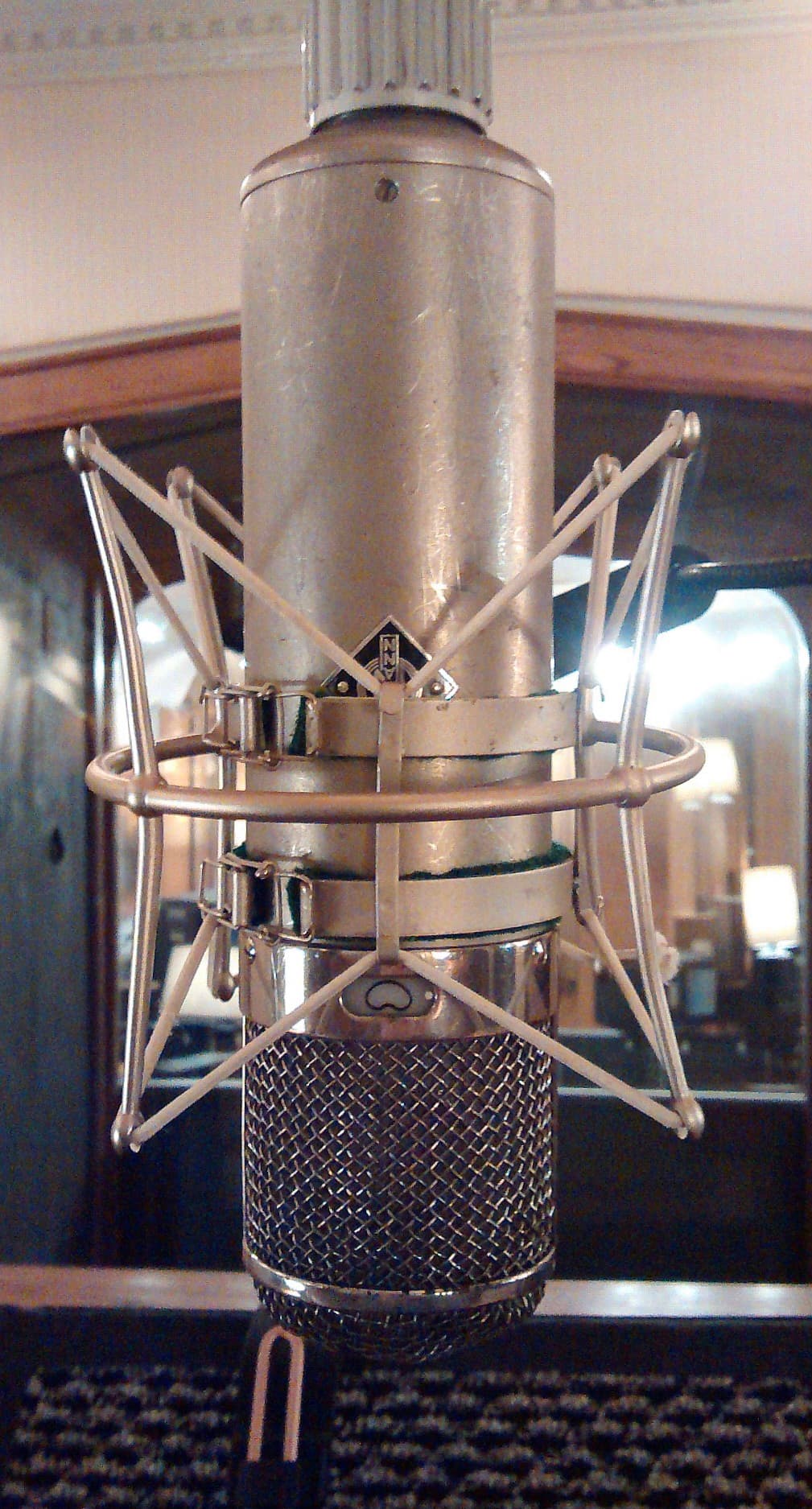 Close-up of a vintage Neumann studio microphone