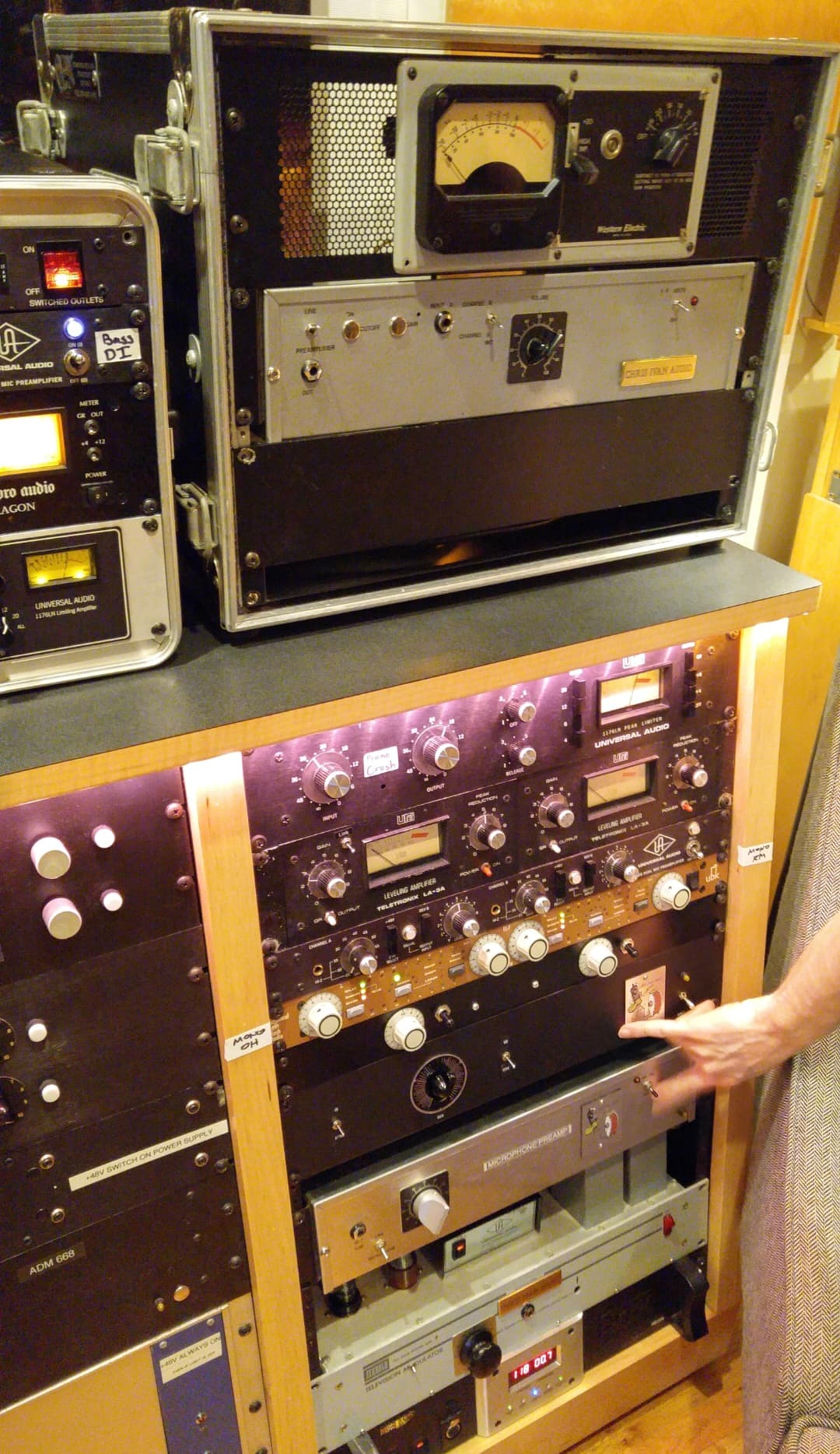 Rack of vintage analog outboard equipment with meters and tube hardware