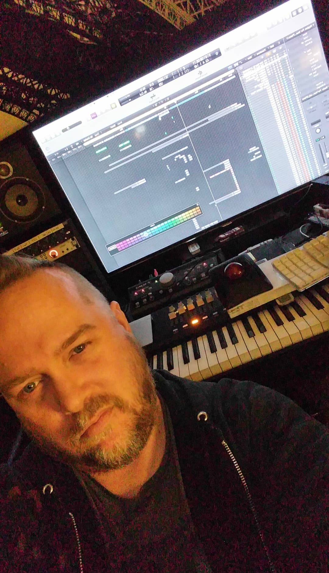 Kene Bell at a personal production workstation with keyboard and digital audio session