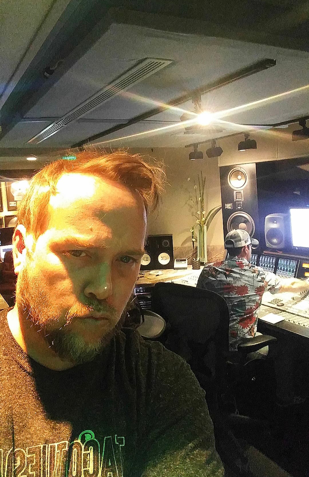 Kene Bell in the foreground of a professional control-room session